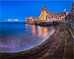 Balluta Bay and Church of Our Lady of Mount Carmel in Saint Julien, Malta