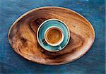Espresso Coffee Drink in cup  on a wooden tray. Top view