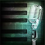 abstract dark green grunge background with retro microphone