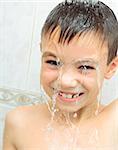 Seven years boy washing in the shower