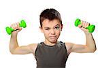 Seven years boy is doing exercises to develop muscles isolated on white background