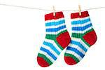 Colorful socks hanging on the clothesline. Image isolated on white background