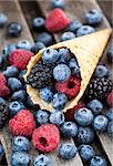 Fresh blueberry, blackberry and raspberry in waffle cone