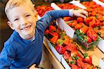 little and proud boy helping with grocery shopping, healthy lifestyle concept