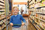 little and proud boy helping with grocery shopping, healthy lifestyle concept