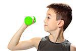 Seven years boy is doing exercises to develop muscles isolated on white background