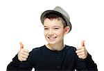 Portrait of a happy boy showing thumbs up on white background
