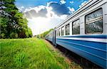 Train wagon and pine forest at sunny day