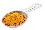 turmeric root powder on measuring tablespoon isolated with a clipping path