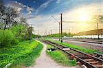 Electric poles on a railway station at sunrise