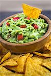 Guacamole in Wooden Bowl with Tortilla Chips