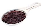 acai berry powder on a measuring tablespoon isolated with a clipping path