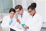 Concentrated scientists working together in laboratory