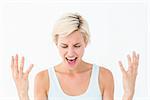 Angry blonde yelling with hands up on white background