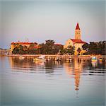 Cathedral of St. Lawrence illuminated at sunrise, Stari Grad (Old Town), Trogir, Dalmatia, Croatia, Europe