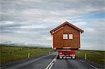 Wooden house being transported on a truck, South Iceland, Iceland, Polar Regions