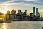 Brooklyn Bridge and Lower Manhattan skyline at sunset, New York City, New York, United States of America, North America