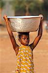 Water chore in an African village, Togo, West Africa, Africa