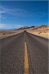 Paved Road in Desert Landscape, Death Valley National Park, California, USA