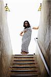 Portrait of Woman Standing at top of Staircase, Arc de Triomphe, Paris, France