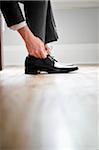 Close-up of Groom Tying Shoelaces