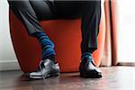 Close-up of Groom with Striped Socks Putting on Shoes