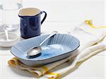 Close-up of Spoon in Bowl and Pitcher, Studio Shot