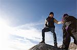 Couple on top of rock, Connemara, Ireland