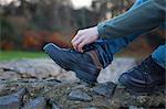 Man tying shoelace, Connemara, Ireland