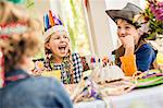 Boys and girls laughing at kids birthday party