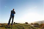 Hiker enjoying view from hilltop, Montseny, Barcelona, Catalonia, Spain