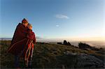 Couple enjoying view from hilltop, Montseny, Barcelona, Catalonia, Spain