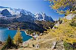 The majestic Marmolada Group and the Lake Fedaia with its turquoise waters, Dolomites, Italy, Europe