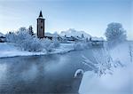 The church of Sils-Baselgia, in a winter landscape covered in snow in Lower Engadine, from the banks of River Inn after sunrise, Graubunden, Switzerland, Europe