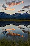 Orange clouds at sunset reflected in a lake, Jasper National Park, UNESCO World Heritage Site, Alberta, Rocky Mountains, Canada, North America