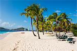 Palm fringed white sand beach on Palm Island with Union Island in the background, the Grenadines, St. Vincent and the Grenadines, Windward Islands, West Indies, Caribbean, Central America