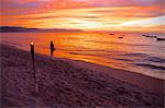 Torch and couple on the beach in Downtown at sunset, Puerto Vallarta, Jalisco, Mexico, North America