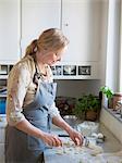 Woman preparing food in kitchen