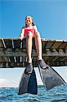 girl wearing flippers on jetty