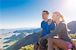 Trail running couple looking out at landscape on Pacific Crest Trail, Pine Valley, California, USA