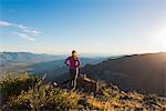 Young female trail runner looking at view on Pacific Crest Trail, Pine Valley, California, USA