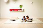 Children using computer at home, Munich, Bavaria, Germany