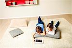 Children using tablet computer at home, Munich, Bavaria, Germany