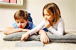 Children using computer at home, Munich, Bavaria, Germany