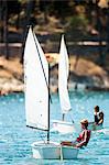 Two boys racing in a sailboat, Hvar island, Croatia