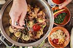 Person preparing potato salad