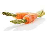 Fresh asparagus and smoked salmon pieces isolated on white background. Culinary healthy light eating.