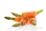 Culinary seafood background. Asparagus wrapped in raw salmon.