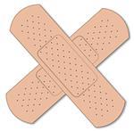 A pair of typical first aid sticking plasters over a white background