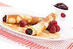 Delicious pancakes on plate in red and white. Culinary sweet eating.
